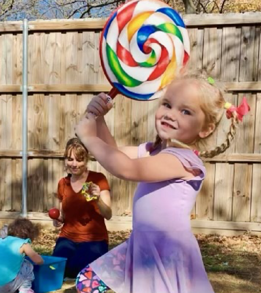 Girl Holding Lollipop