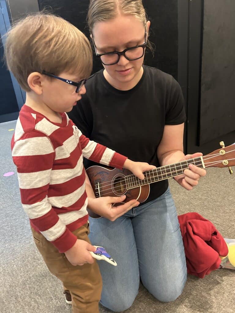 Young Child with ukulele